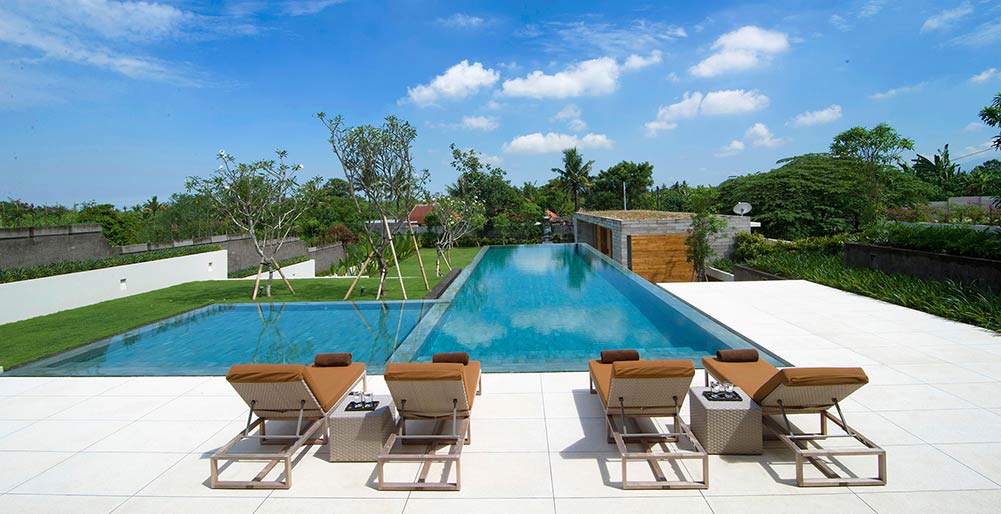 The Iman Villa - Sunloungers by the pool